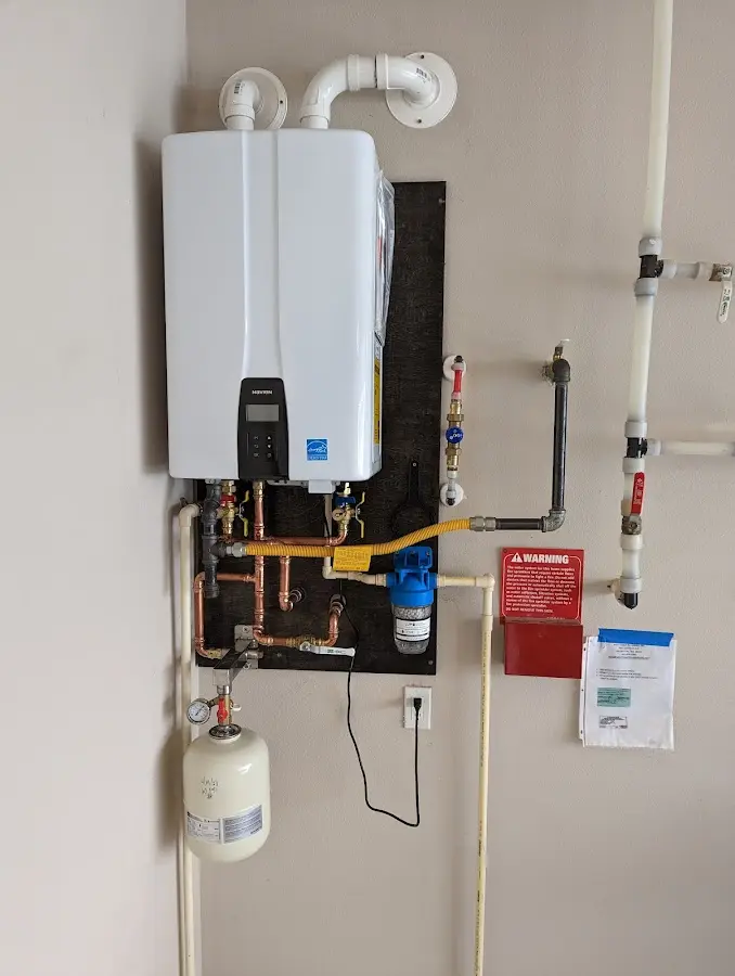 Professional plumber installing copper piping in a Imperial Beach home